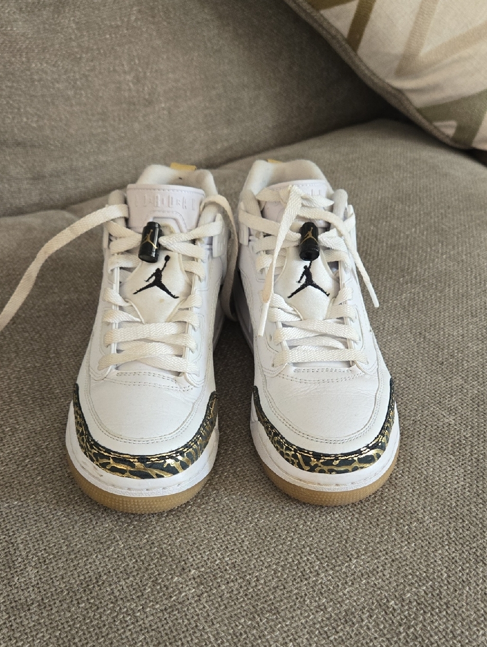 Jordan White Sneakers with Black Jumpman and Gold Crackle Trim